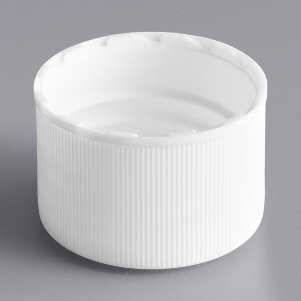 A 24/410 white plastic bottle cap with foam liner.
