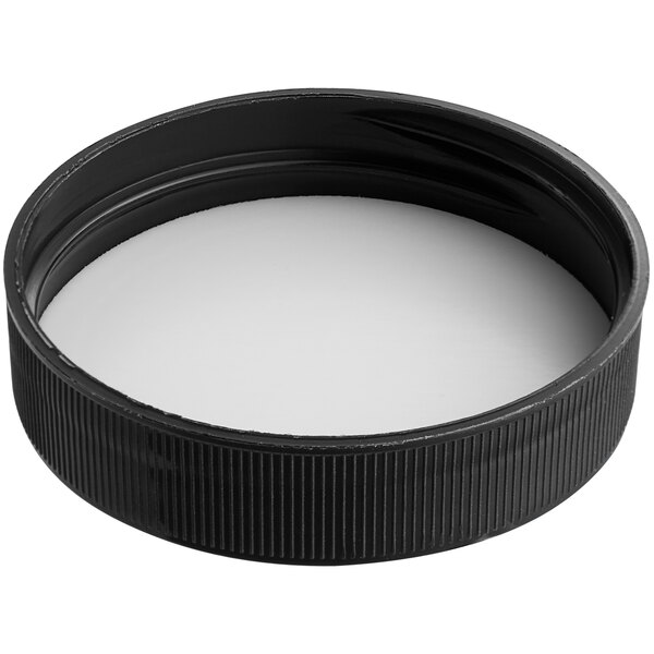 A black plastic cap with a white foam liner.