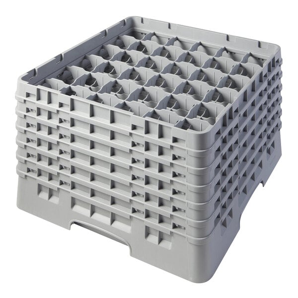 A gray plastic Cambro glass rack with 36 compartments and extenders.