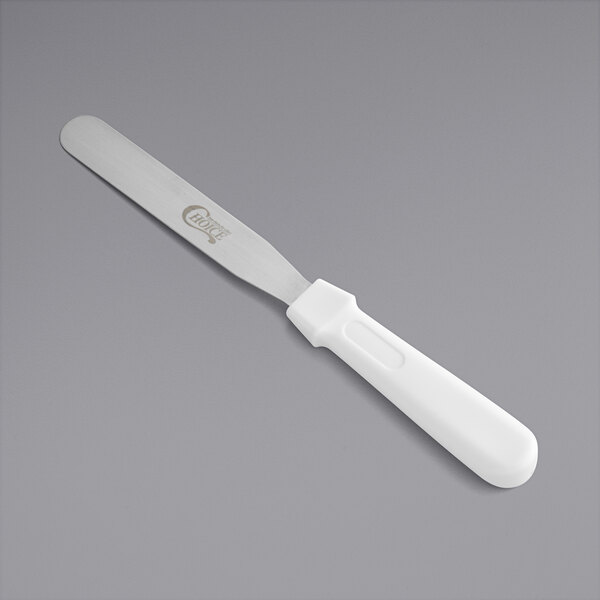A white baking spatula with a plastic handle.