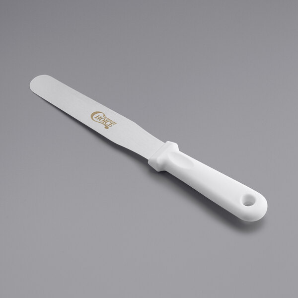 A white spatula with a white handle.