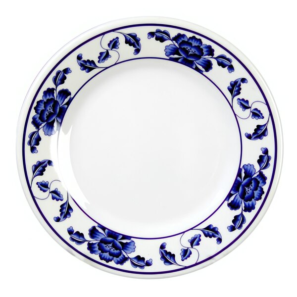 A white Thunder Group melamine plate with blue flowers on it.