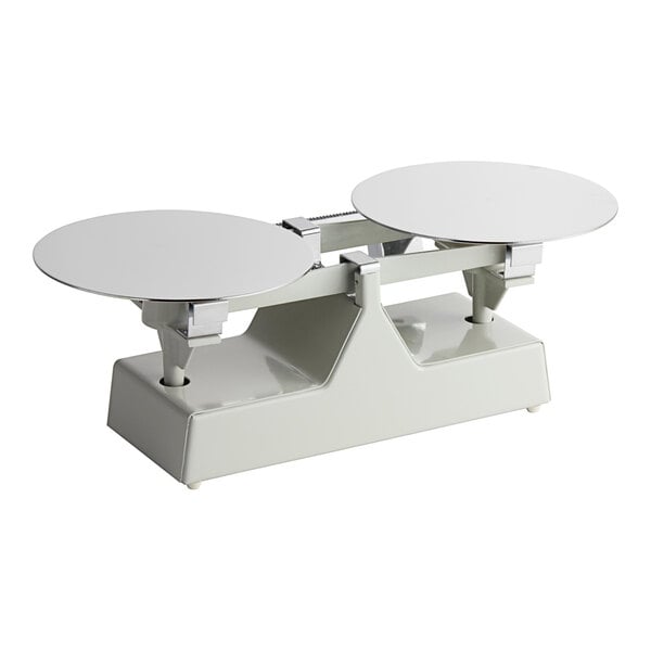 A white balance scale with two round discs.