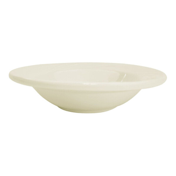 A shallow, round, bone white porcelain bowl with a wide rim.
