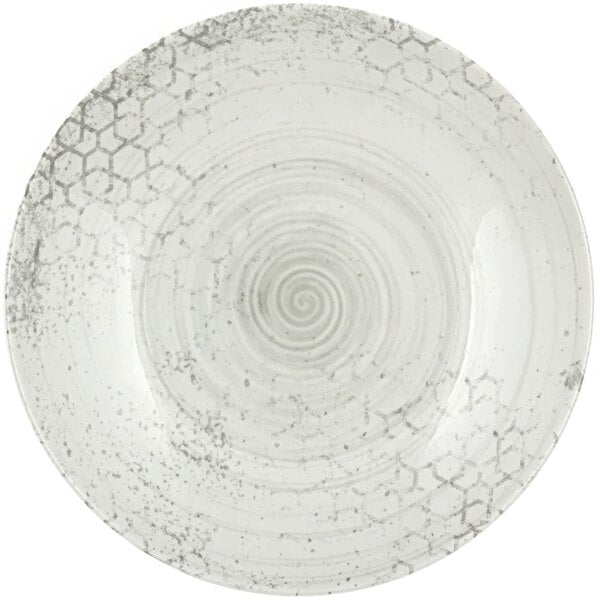 A white plate with a swirly surface.