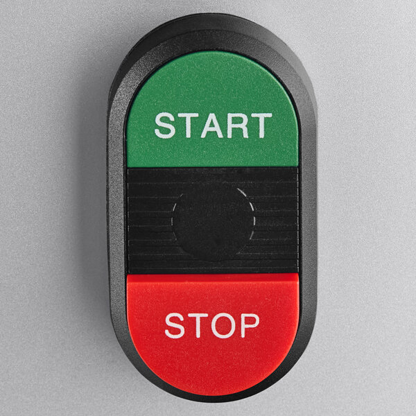 A close-up of a start button on a ProCut KT-8 meat tenderizer.