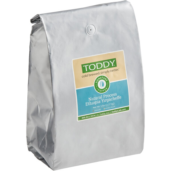 A silver Toddy coffee bag with a label.