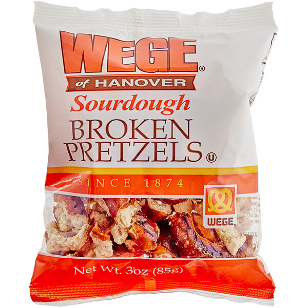 A case of Wege of Hanover broken pretzels on a white surface.