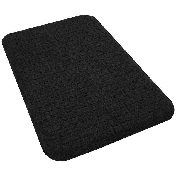 A coal black rectangular M+A Matting anti-fatigue mat with squares on it.