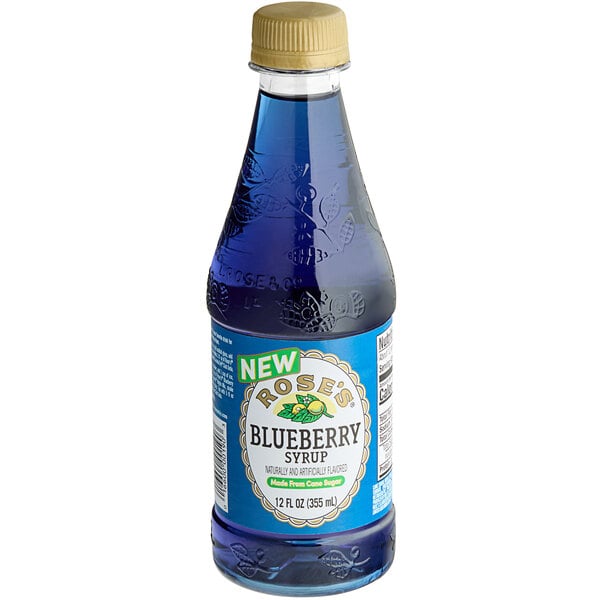 A close up of Rose's Blueberry Syrup, a bottle of blue liquid.