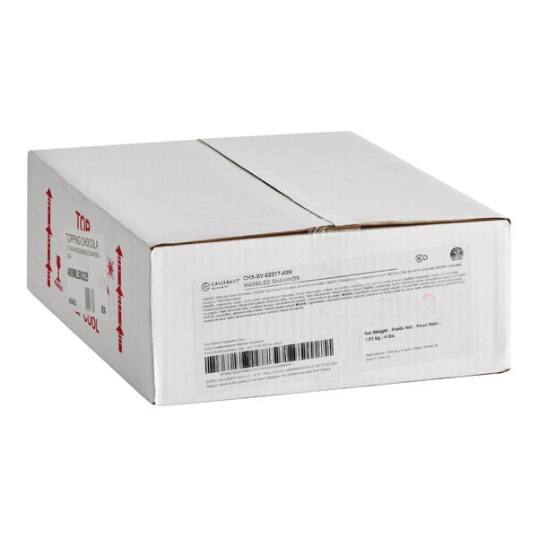 A white cardboard box containing 4 pounds of Callebaut marbled chocolate shavings.