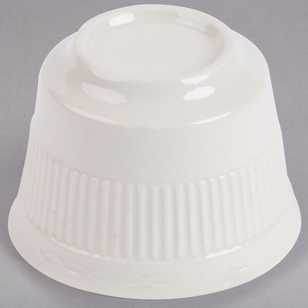 An Ivory (American White) china bouillon cup with an embossed rim.