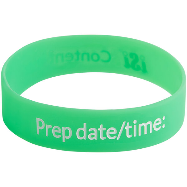 A green rubber bracelet with white text that reads "prep date time"