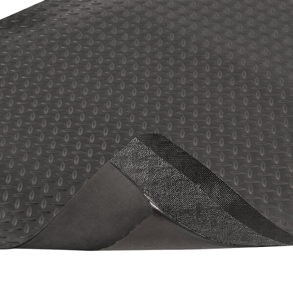 A black rubber Notrax Diamond Stat anti-fatigue mat with a textured surface.