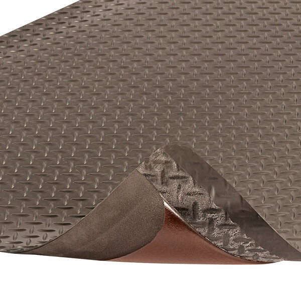 A black Notrax anti-fatigue mat with brown diamond patterns.