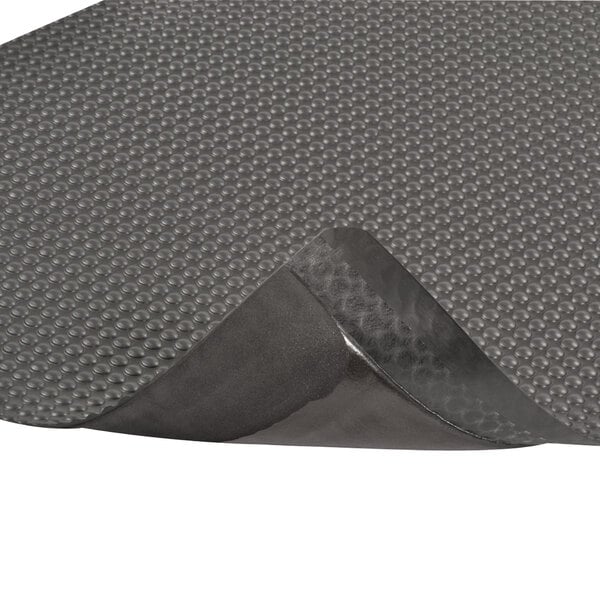 A close-up of a black Notrax Bubble Trax Ultra anti-fatigue mat.