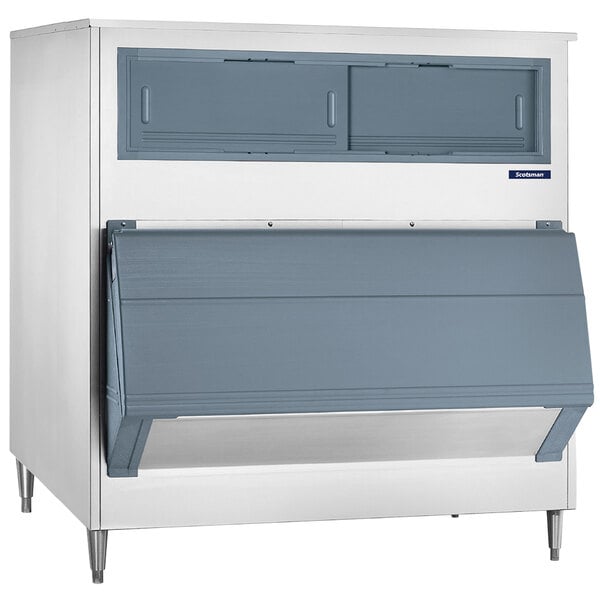 A Scotsman stainless steel ice storage bin with two drawers.