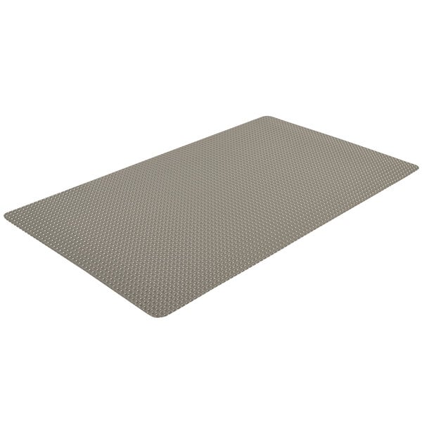 A grey rectangular mat with a small grid pattern on it.