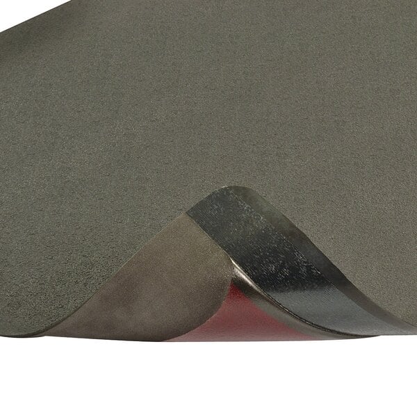 A black anti-fatigue mat with a grey surface and black edges.