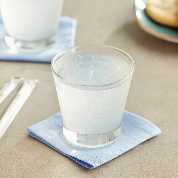 A glass of Old Orchard Lemonade on a napkin.