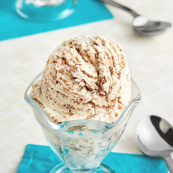 A scoop of S'mores Ice Cream in a glass cup.