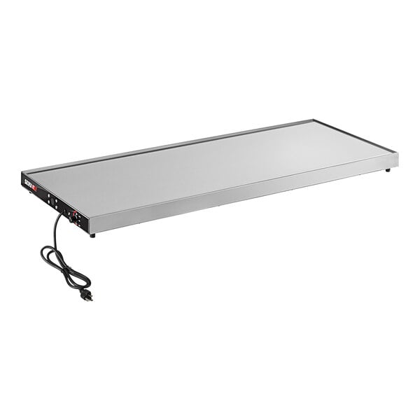 A rectangular stainless steel ServIt heated shelf with a black power cord.