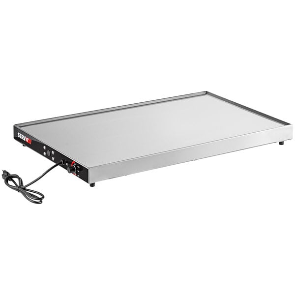 A rectangular stainless steel ServIt heated shelf warmer with a black cord.