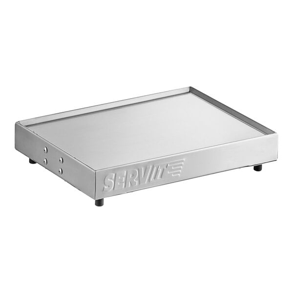 A silver rectangular stainless steel ServIt heated shelf warmer with a white surface.