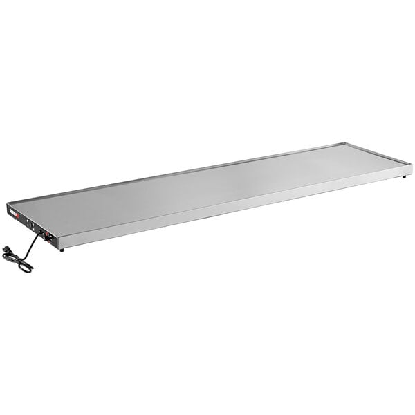 A white rectangular ServIt heated metal shelf with a cord.