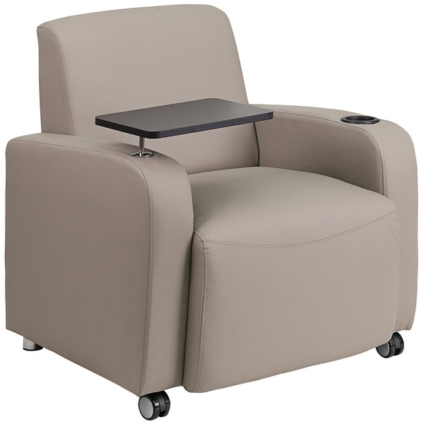 A Flash Furniture gray leather guest chair with a tablet arm and front casters.