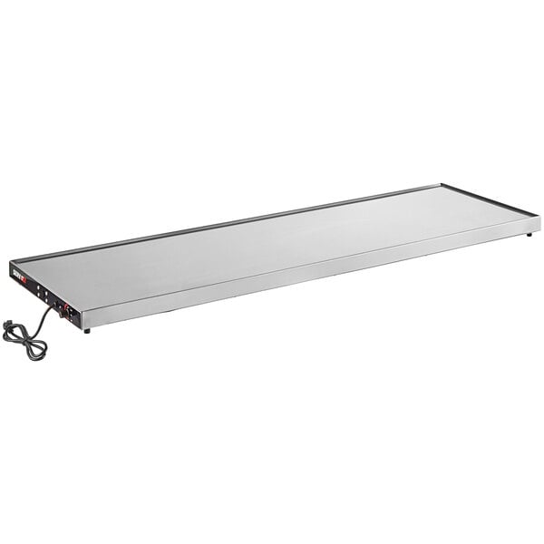 A white rectangular stainless steel ServIt heated shelf with a cord.