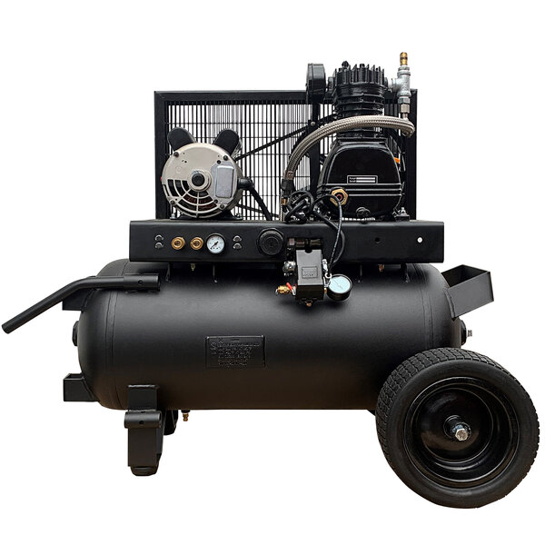 An Industrial Gold wheel barrow style air compressor with wheels.