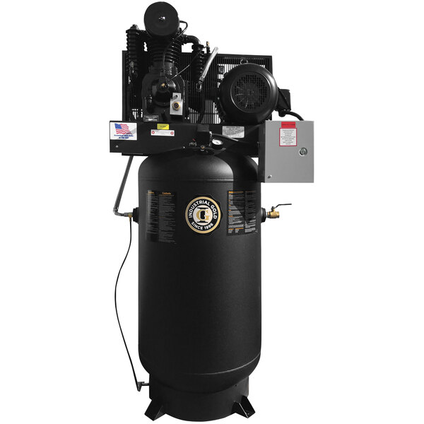 An Industrial Gold black vertical air compressor with a large cylinder.