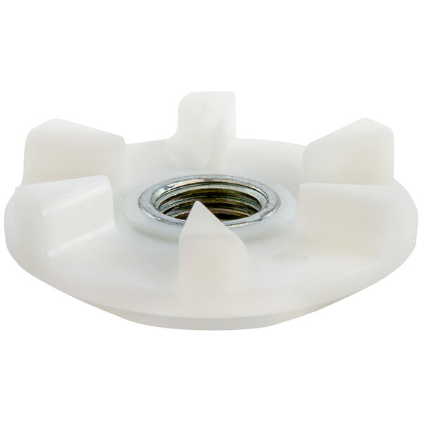 A white plastic nut with a metal nut in the center.