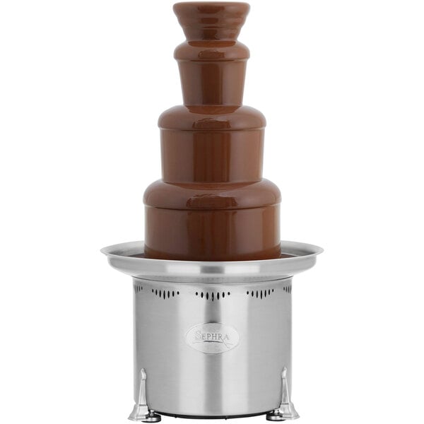 A Sephra Montezuma chocolate fountain on a stand on a table.