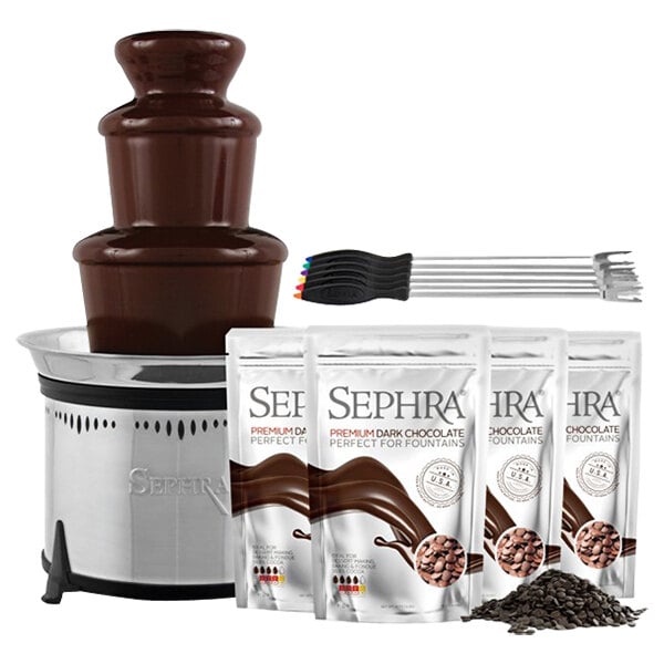 A Sephra chocolate fountain on a counter with a white package of brown chocolate.
