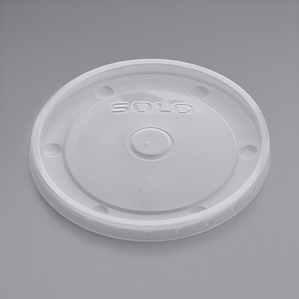 A white plastic Solo vented lid for a 16 oz. food cup with a white circle and text.
