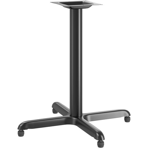 A Lancaster Table & Seating black metal table base with four legs.