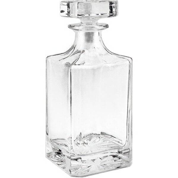 A Franmara clear glass decanter with a crystal stopper.