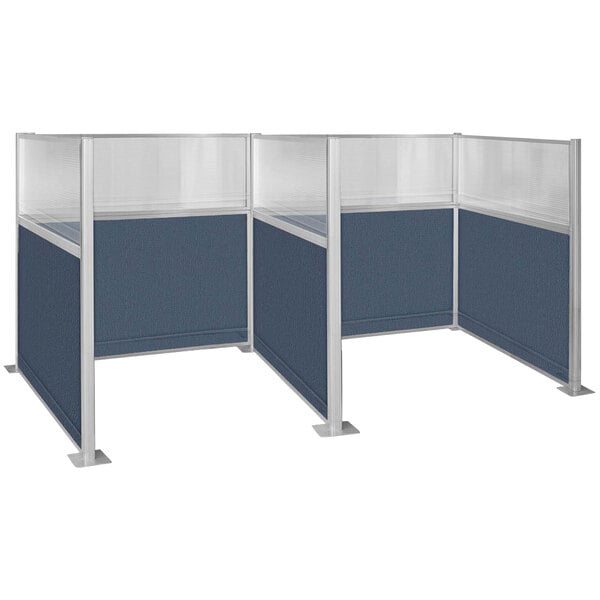 Three Versare Hush Panel metal cubicles with blue fabric and windows.