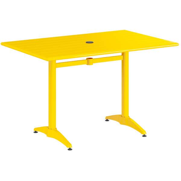 A Lancaster Table & Seating yellow powder-coated aluminum table with legs.
