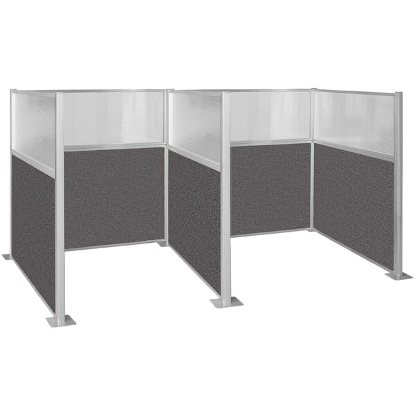 A Versare charcoal grey H/W-shape double cubicle with window and glass panels.