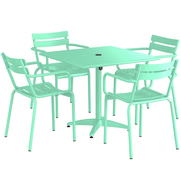 A Lancaster Table and Seating seafoam green table with 4 chairs.