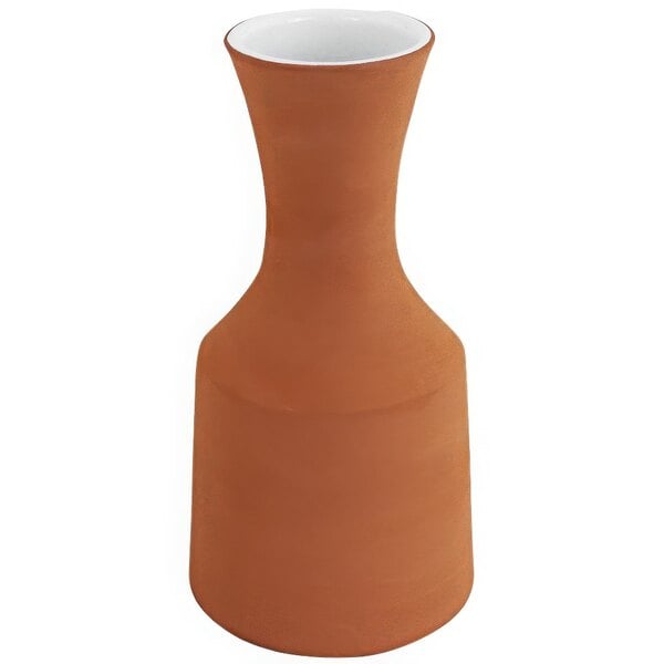 A brown Franmara Santa Fe Terra Cotta carafe with a white rim.