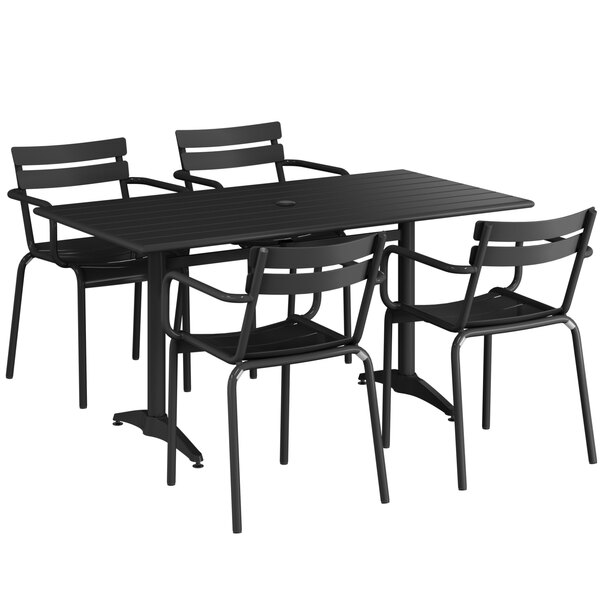 A black Lancaster Table & Seating outdoor dining set with four chairs on a table.