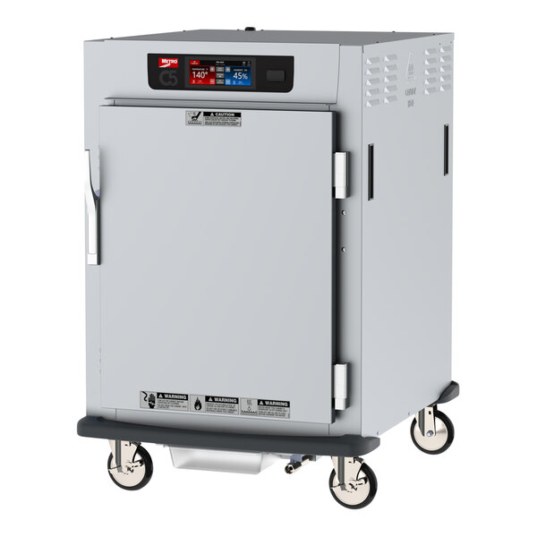 A Metro C5 pass-through heated holding and proofing cabinet with clear and solid doors on wheels.