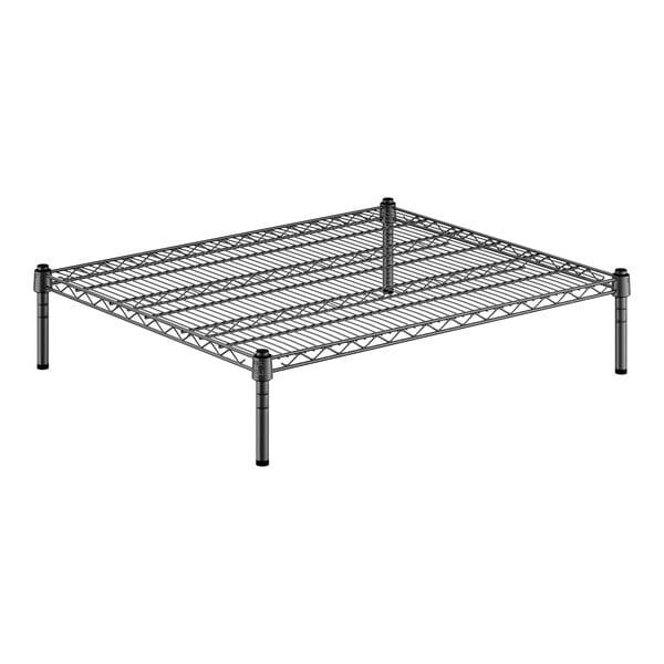 A black metal wire shelf with metal posts.