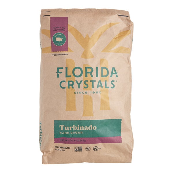 A brown Florida Crystals bag of turbinado cane sugar with blue and green labels.