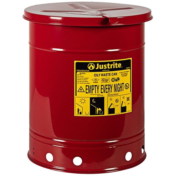 A red barrel with a yellow label that says "Oily Waste Can"