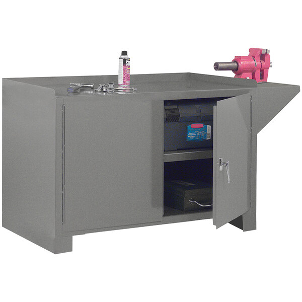 A grey metal workbench with a grey metal cabinet on top.